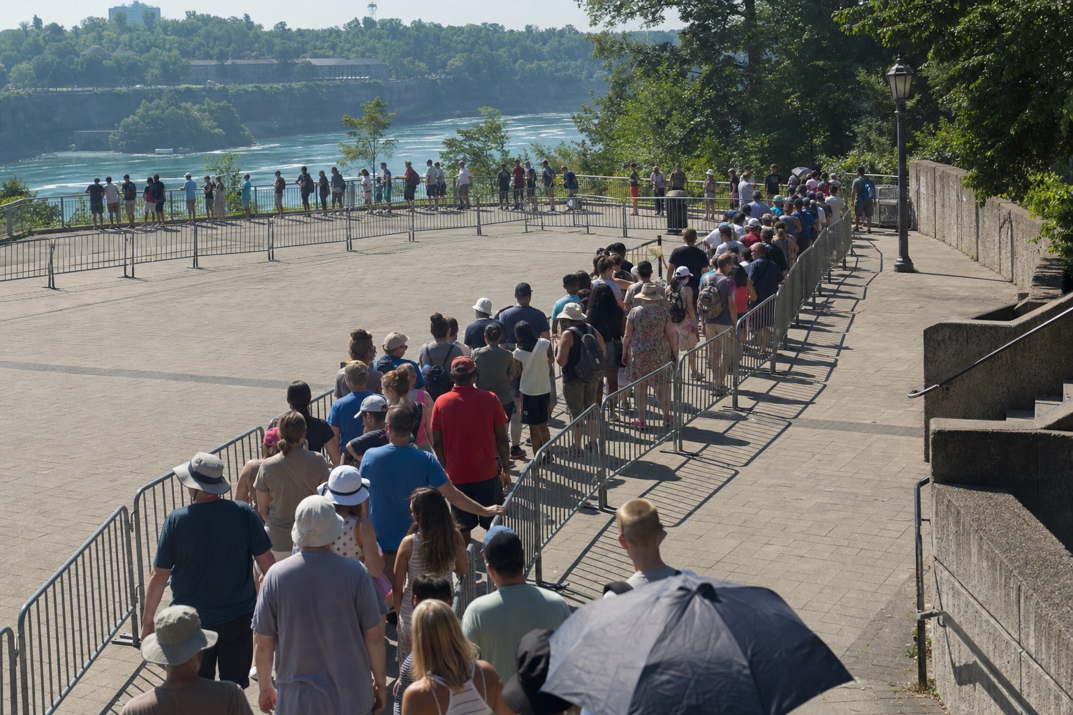 A switchback queue of visitors in a plaza above the gorge waiting for the elevator down to the boat landing