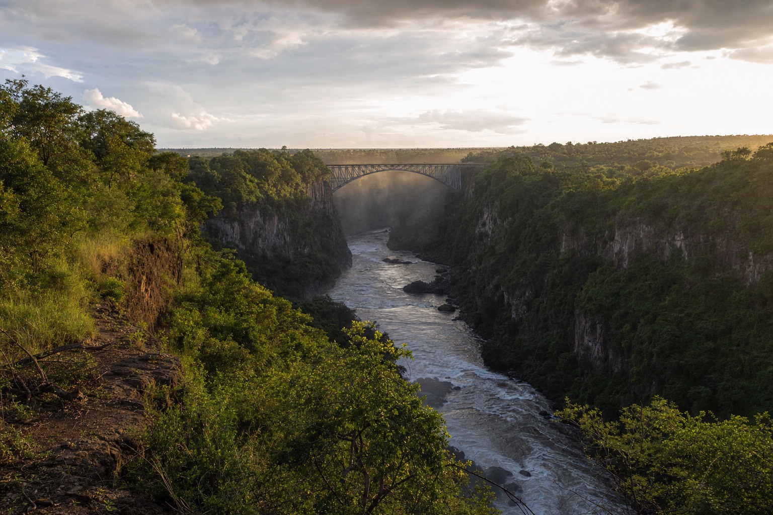 The gorge between the two countries with the American shore on one side and Canadian shore on the other, bridge in the distance
